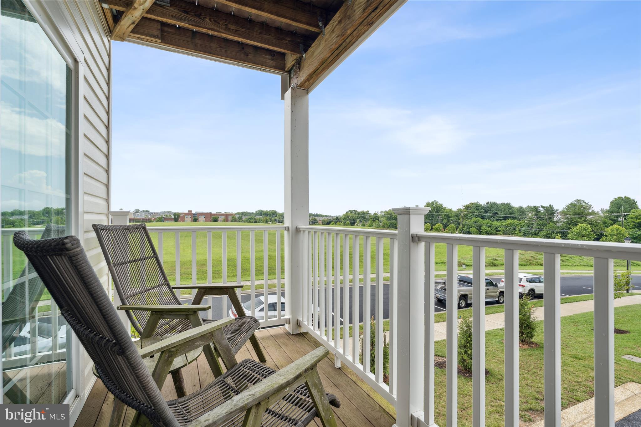9454 James Macgowan Lane, Unit 447 Owings Mills, MD 21117 - Photo 15 of 41 a view of a balcony with a table and chairs