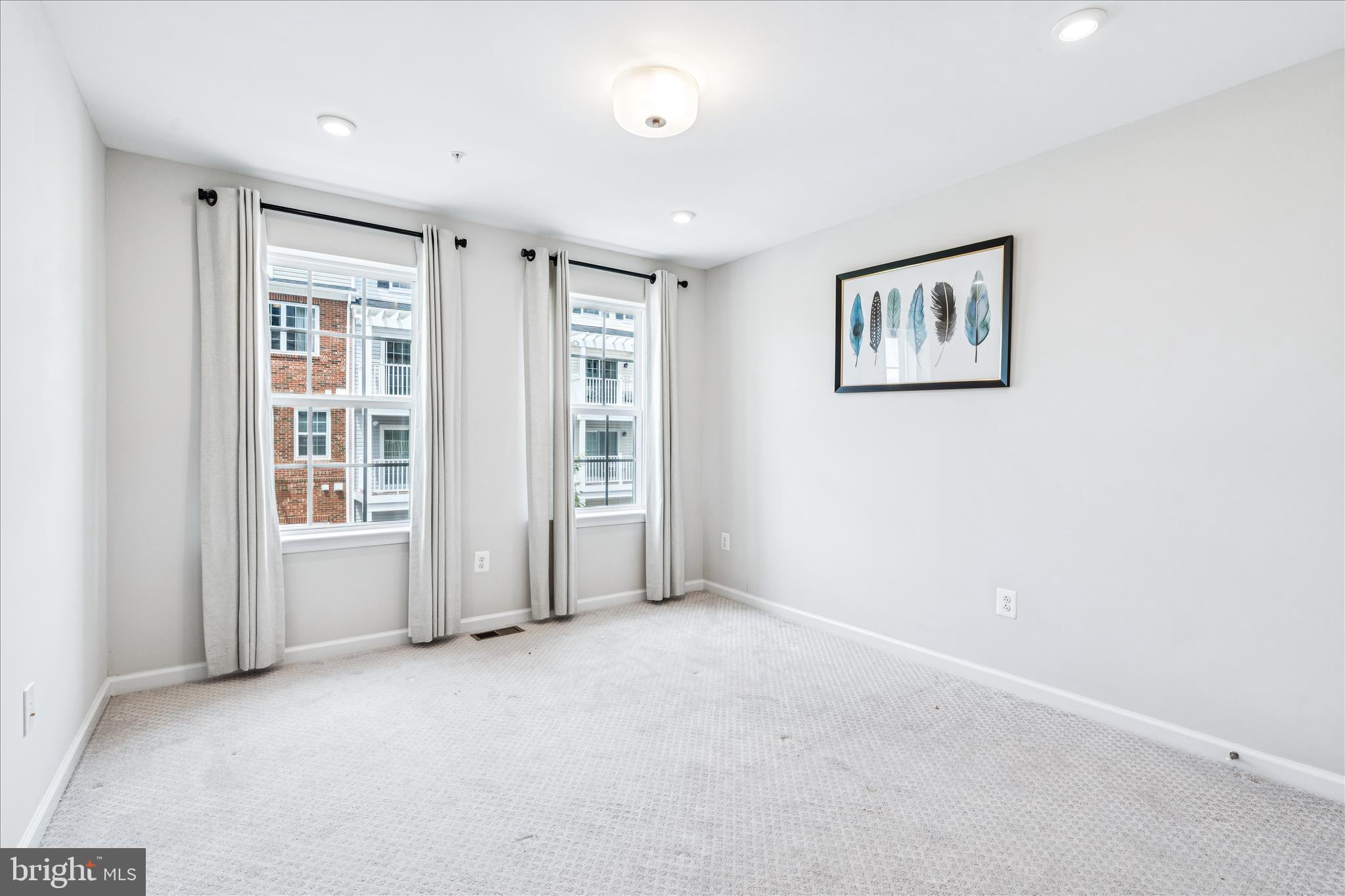 9454 James Macgowan Lane, Unit 447 Owings Mills, MD 21117 - Photo 22 of 41 an empty room with windows
