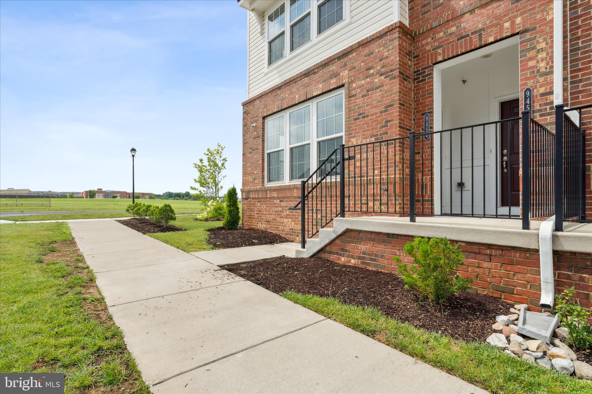 9454 James Macgowan Lane, Unit 447 Owings Mills, MD 21117 - Photo 40 of 41 a view of a house with backyard and garden