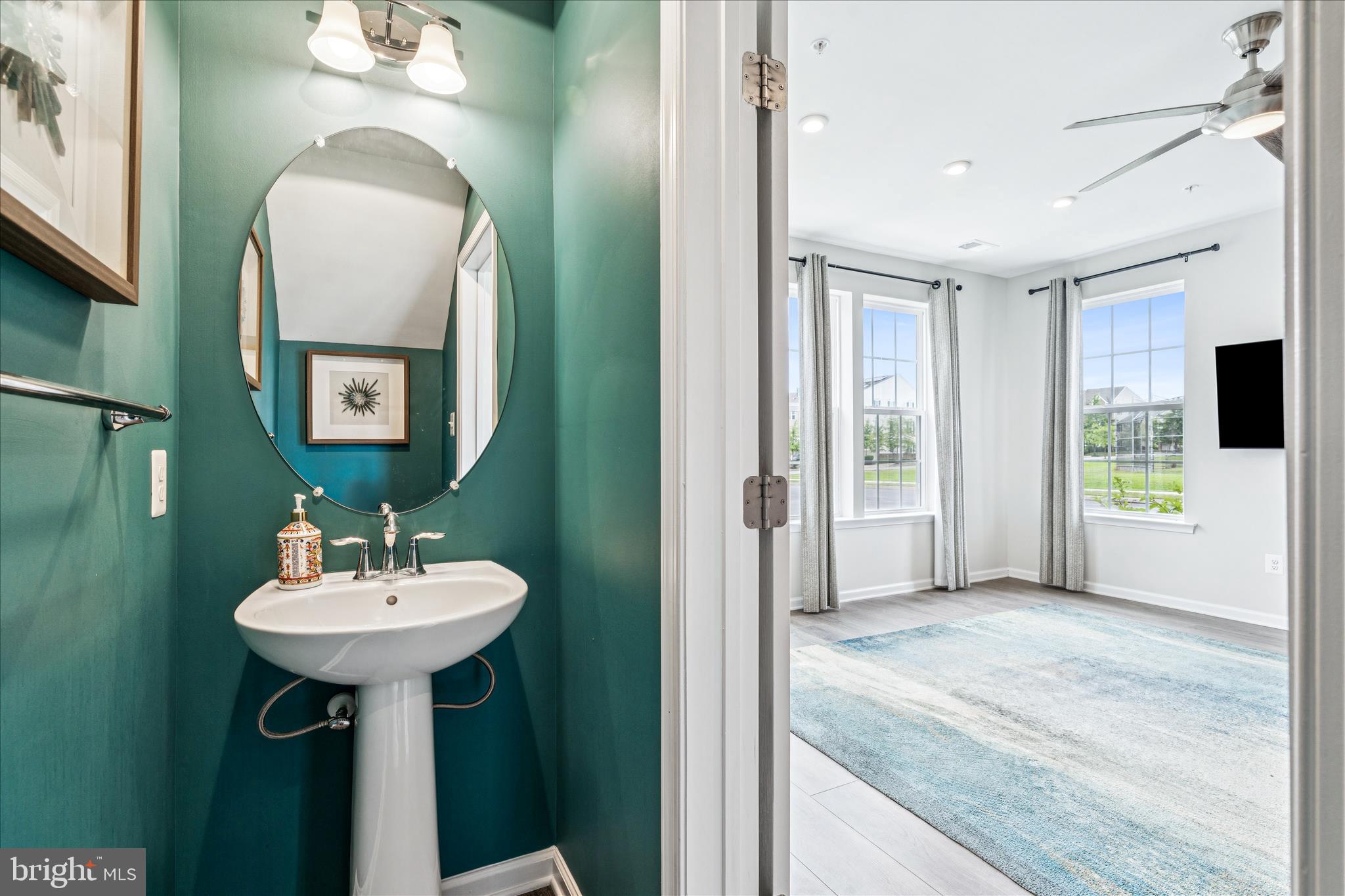 9454 James Macgowan Lane, Unit 447 Owings Mills, MD 21117 - Photo 6 of 41 a en suite bathroom with a sink and a mirror