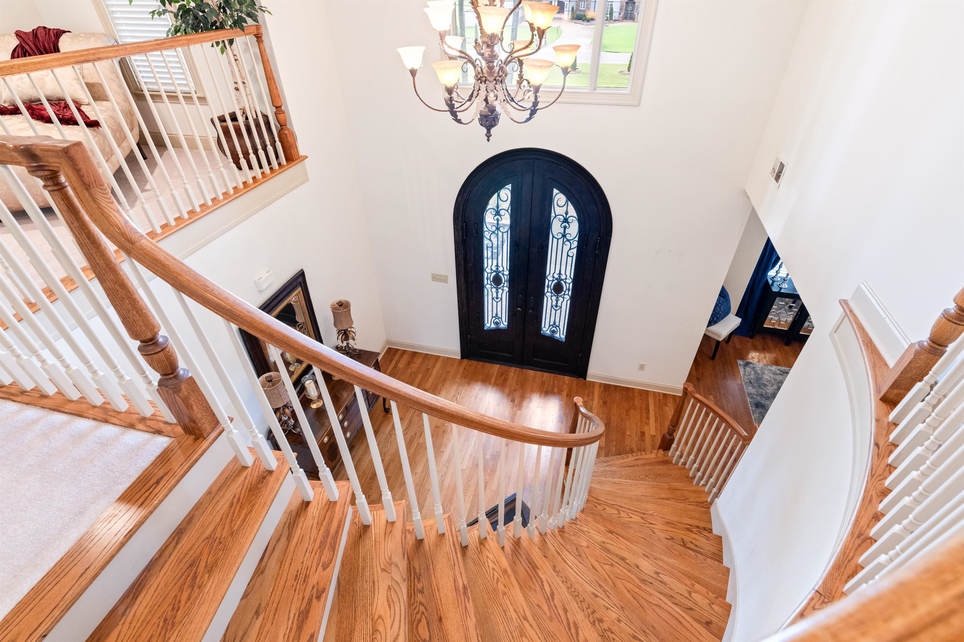 11241 Latting Road Eads, TN 38028 - Photo 25 of 31 Foyer entrance featuring wood-type flooring, french doors, and a notable chandelier