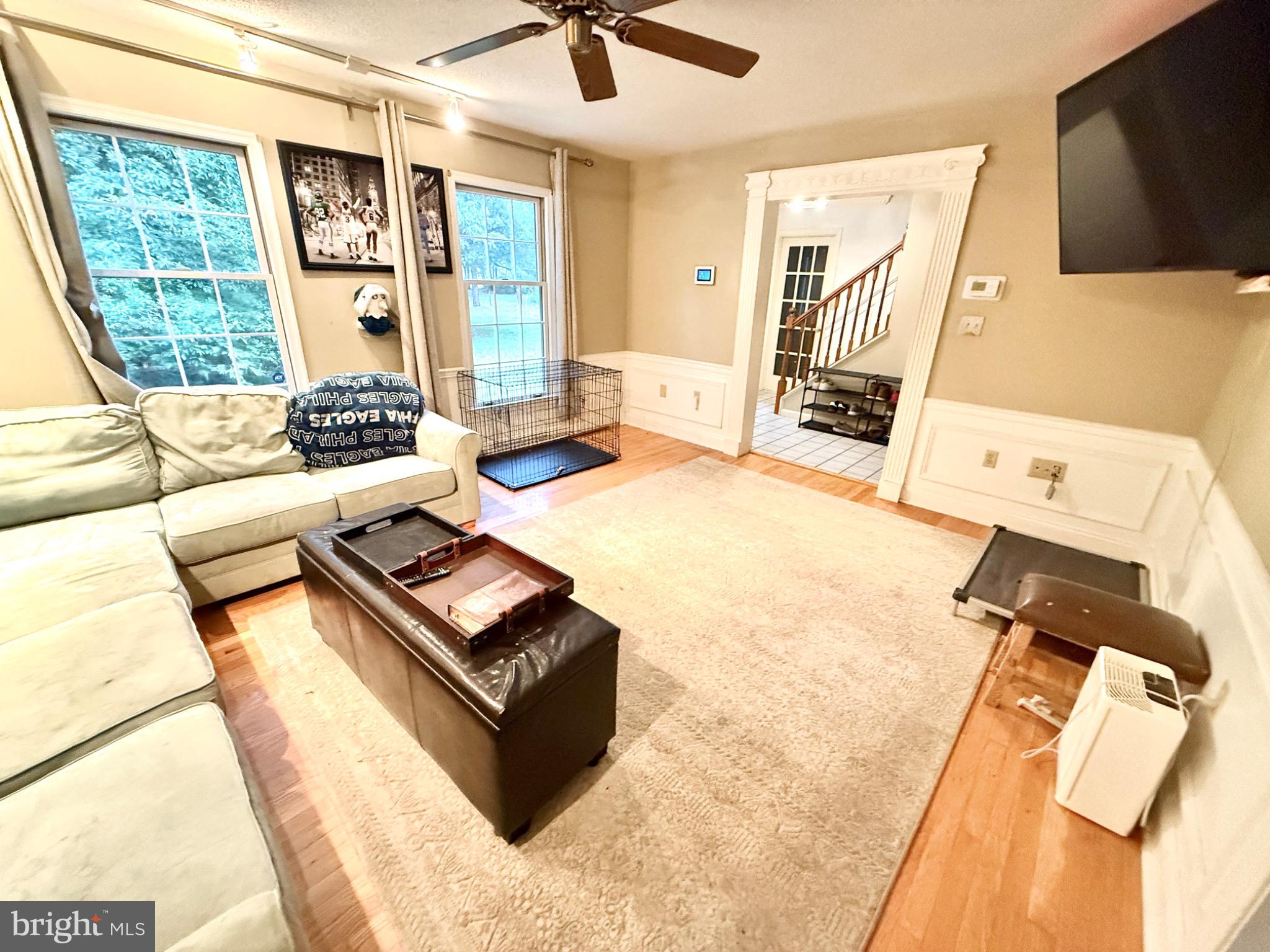 30772 River Road Laurel, DE 19956 - Photo 3 of 21 a living room with furniture and a flat screen tv