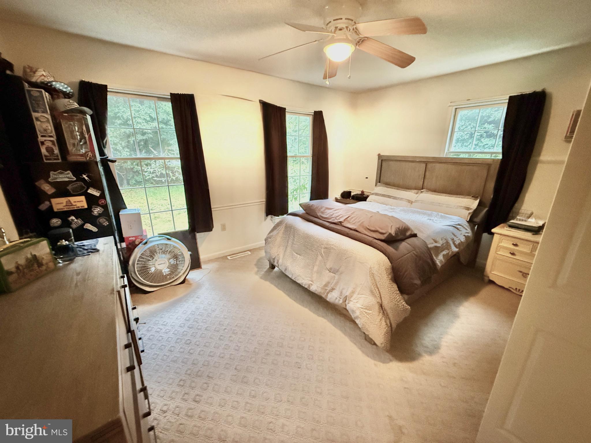 30772 River Road Laurel, DE 19956 - Photo 7 of 21 a bedroom with bed and a flat tv screen on dresser