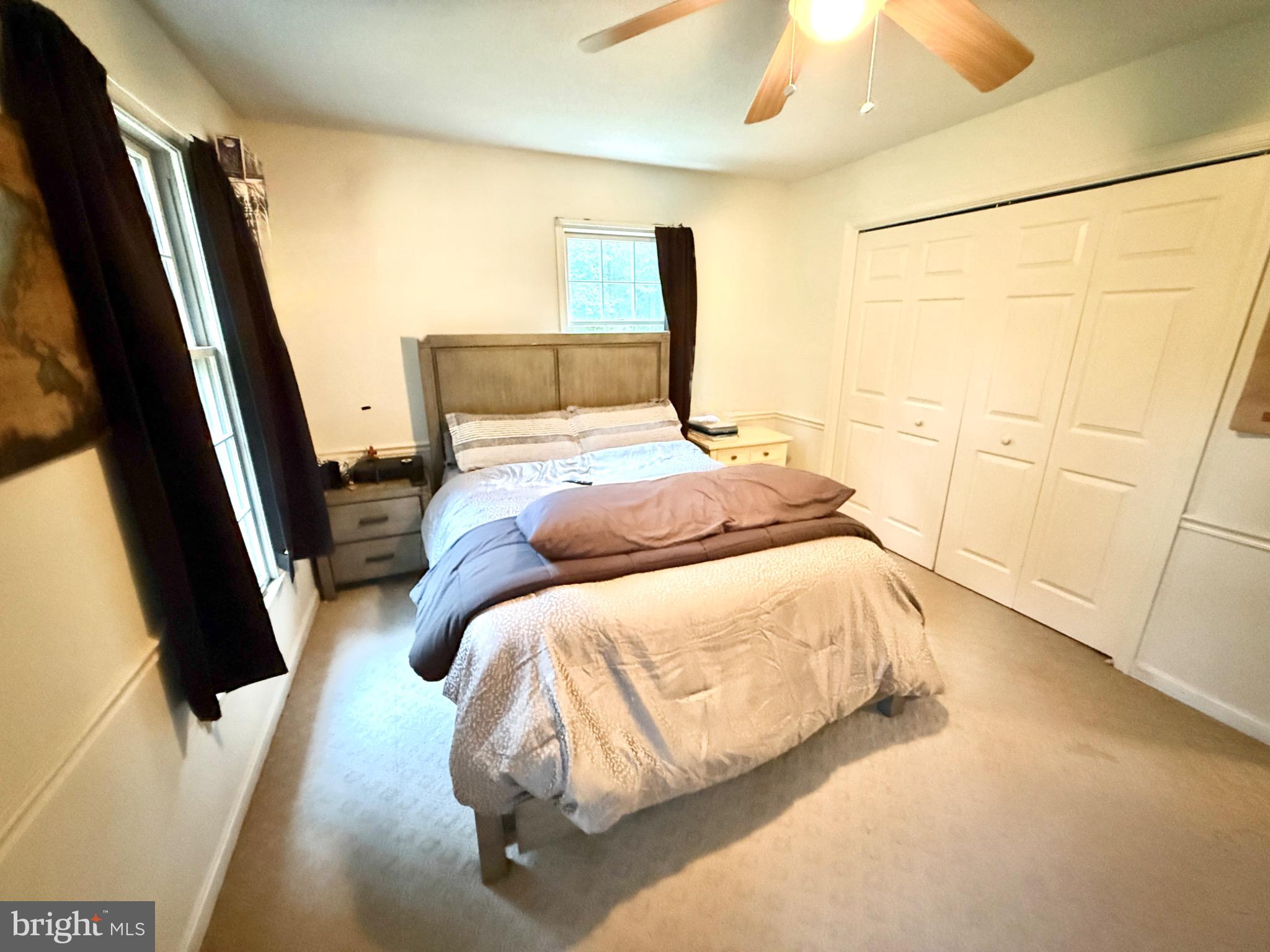 30772 River Road Laurel, DE 19956 - Photo 8 of 21 a bedroom with a bed and a flat tv screen on the dresser