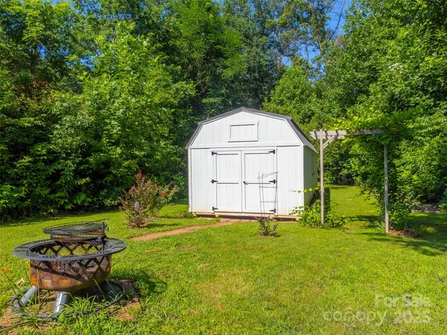 a view of a tiny house with garden
