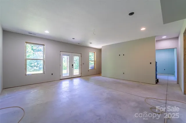 an empty room with windows