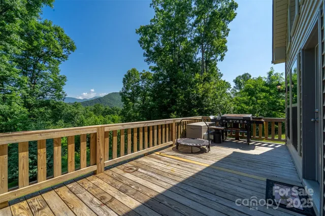 a view of balcony with wooden floor and seating space
