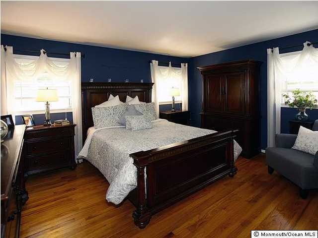 14 Crest Road Middletown, NJ 07748 - Photo 13 of 25 a bed sitting in a bedroom next to a window
