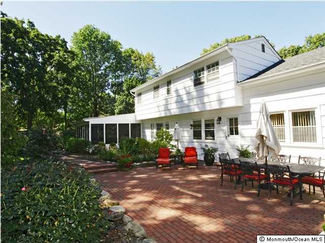 14 Crest Road Middletown, NJ 07748 - Photo 19 of 25 a backyard of a house with yard table and chairs