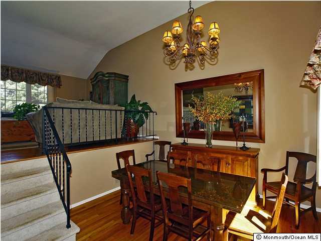 14 Crest Road Middletown, NJ 07748 - Photo 4 of 25 a view of a dining room with furniture a chandelier and wooden floor