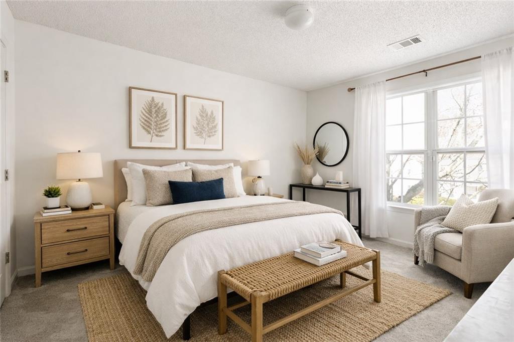 5750 Reps Trace Norcross, GA 30071 - Photo 13 of 18 a bedroom with a bed a table and a large window