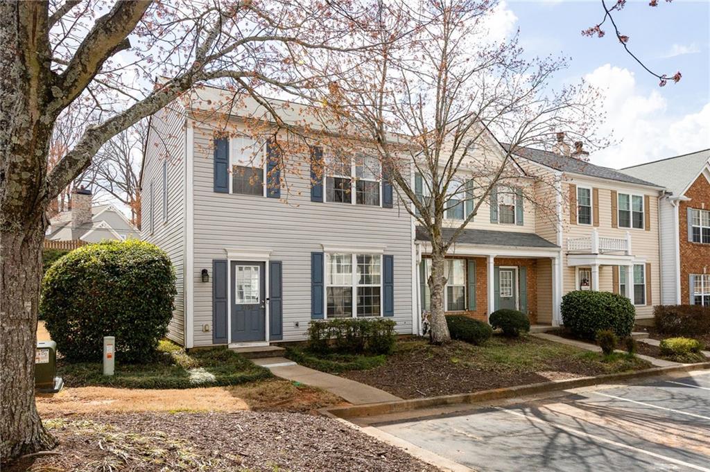 5750 Reps Trace Norcross, GA 30071 - Photo 2 of 18 a front view of a house with garden and plants