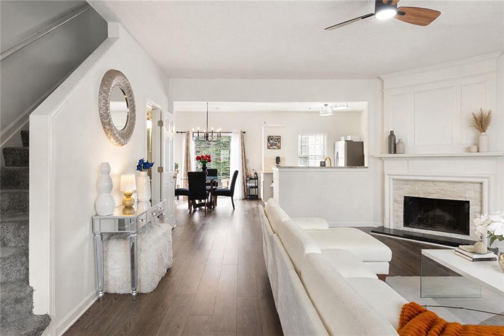 5750 Reps Trace Norcross, GA 30071 - Photo 3 of 18 a living room with furniture a fireplace and a chandelier