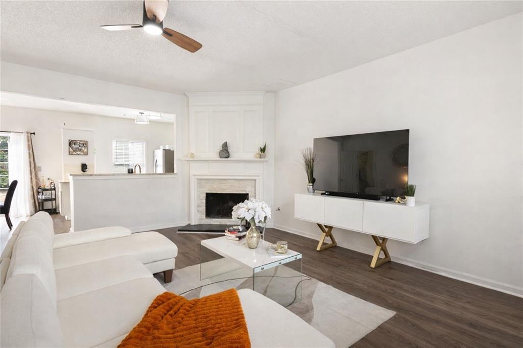 5750 Reps Trace Norcross, GA 30071 - Photo 6 of 18 a living room with furniture a rug and a flat screen tv