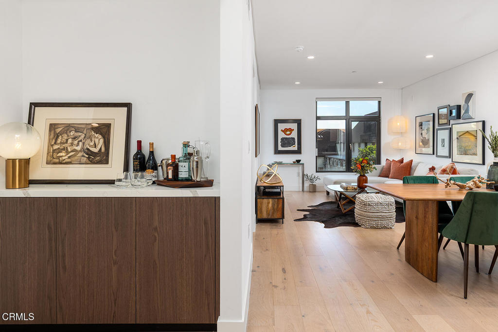 399 East Del Mar Boulevard, Unit 308 Pasadena, CA 91101 - Photo 14 of 32 a living room with furniture and a large mirror
