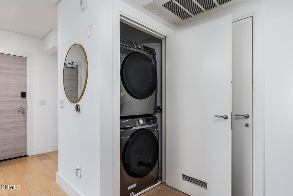 399 East Del Mar Boulevard, Unit 308 Pasadena, CA 91101 - Photo 15 of 32 a close view of utility room with washer and dryer
