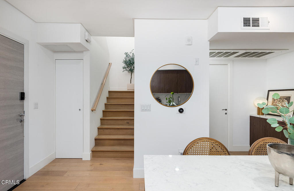 399 East Del Mar Boulevard, Unit 308 Pasadena, CA 91101 - Photo 16 of 32 a view of a livingroom with wooden floor and a large window