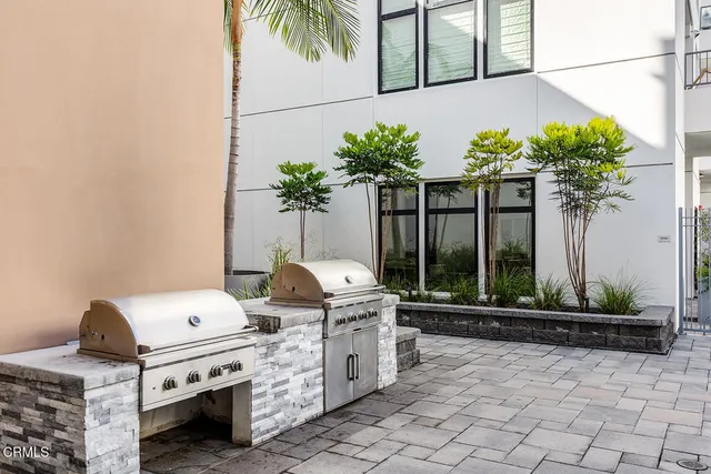a vase of flowers sitting on a floor