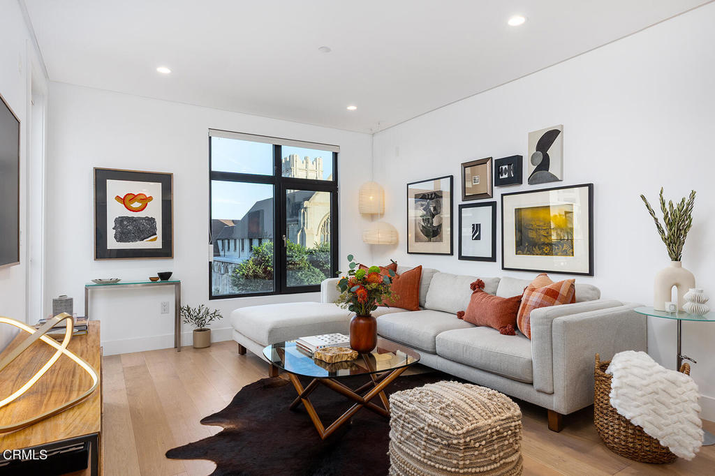 399 East Del Mar Boulevard, Unit 308 Pasadena, CA 91101 - Photo 7 of 32 a living room with furniture and a large window