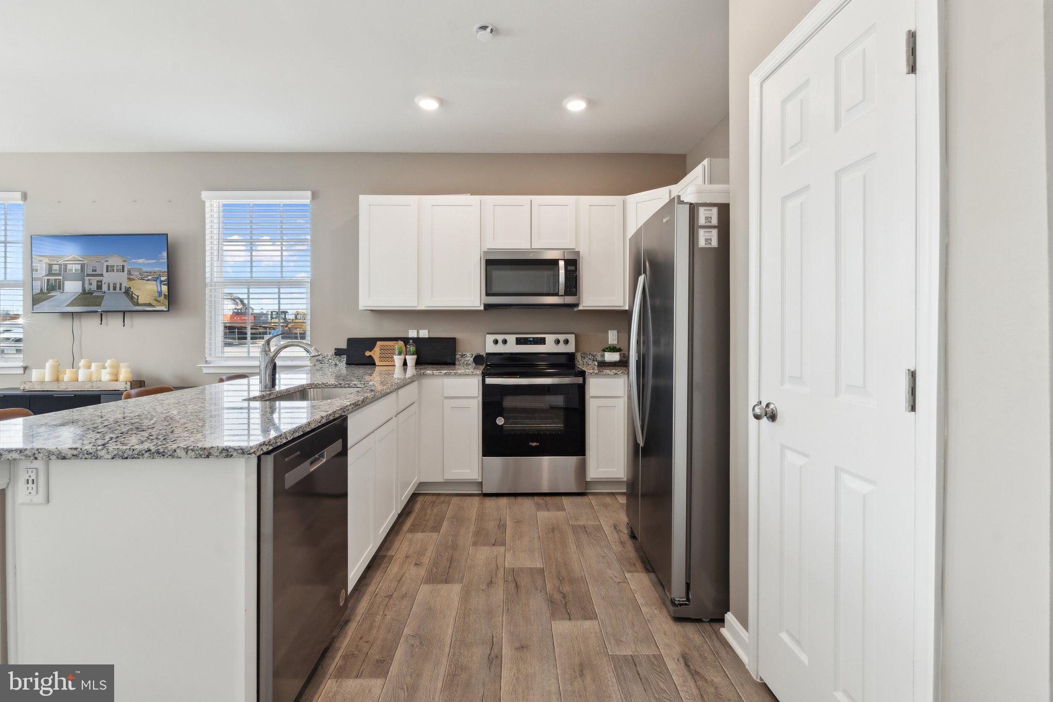 167 Rae Court Luray, VA 22835 - Photo 6 of 31 a kitchen with stainless steel appliances granite countertop a stove top oven a sink and a refrigerator