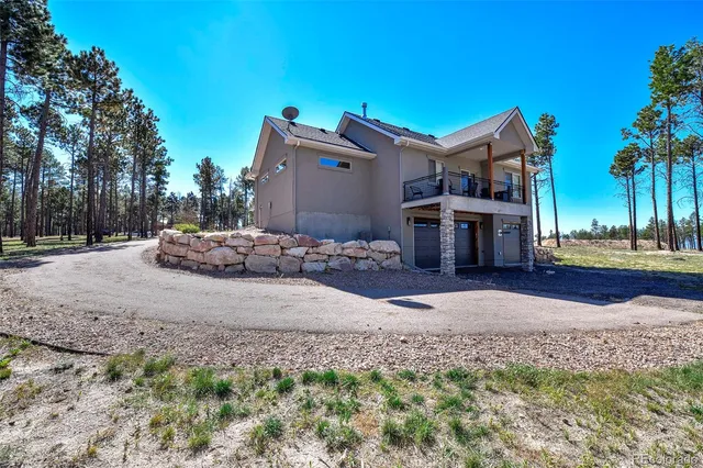 a house with tree in front of it