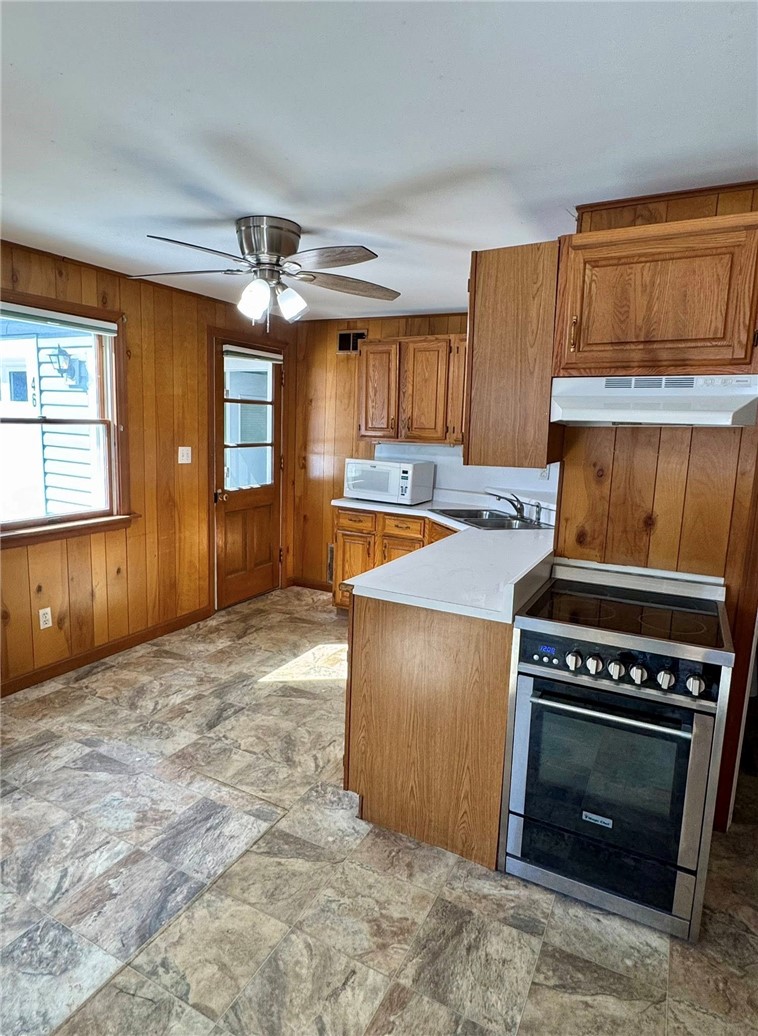 46 Salt Pond Way Westerly, RI 02891 - Photo 15 of 26 Kitchen view number 2 and the door leading to the third rear bedroom and the garage