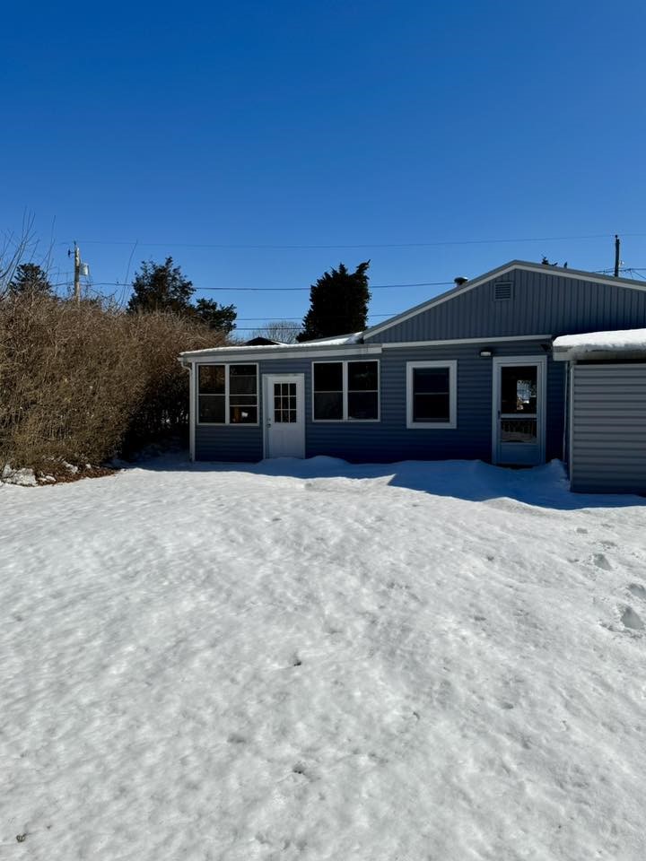 46 Salt Pond Way Westerly, RI 02891 - Photo 9 of 26 Left door to the large enclosed porch/sun room.