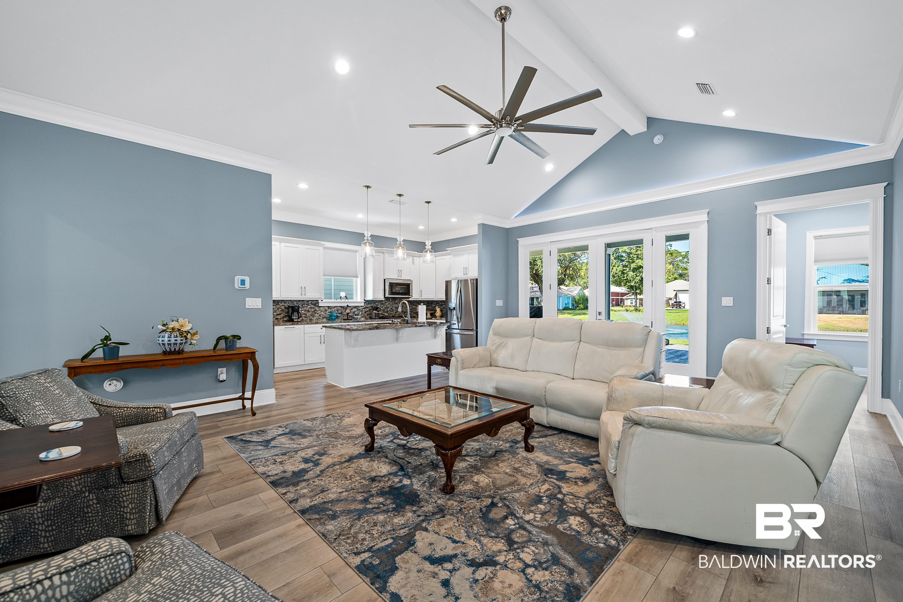 12329 Reunion Place, Unit LOT 38 Foley, AL 36535 - Photo 5 of 43 Living area featuring light wood finished floors, beam ceiling, a ceiling fan, recessed lighting, and high vaulted ceiling