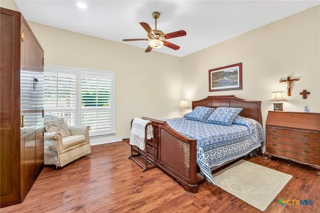 a spacious bathroom with a sink a bathtub and a mirror