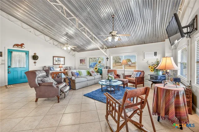 a view of a room with lots of wooden furniture