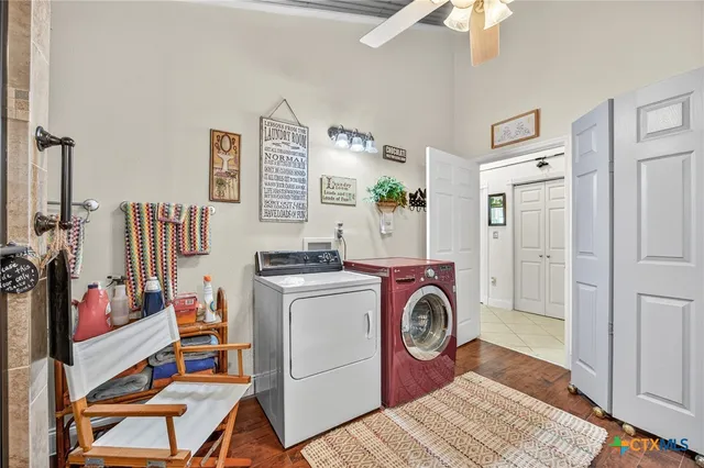 a bathroom with a sink mirror vanity and toilet
