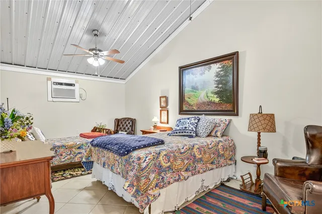 a bedroom with bed and furniture