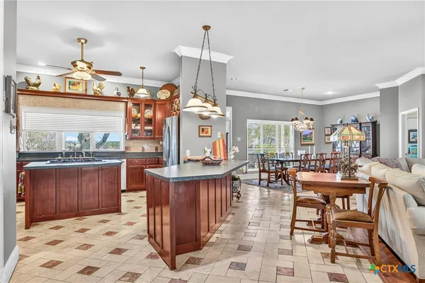 a kitchen with a stove a sink and a refrigerator