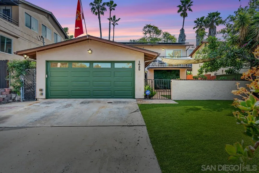 1635 Portola Avenue Spring Valley, CA 91977 - Photo 15 of 54 a front view of a house with a yard and garage