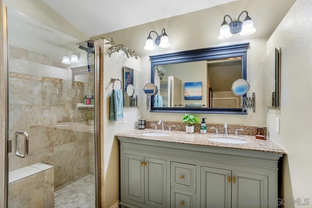 1635 Portola Avenue Spring Valley, CA 91977 - Photo 28 of 54 a bathroom with a double vanity sink mirror and double