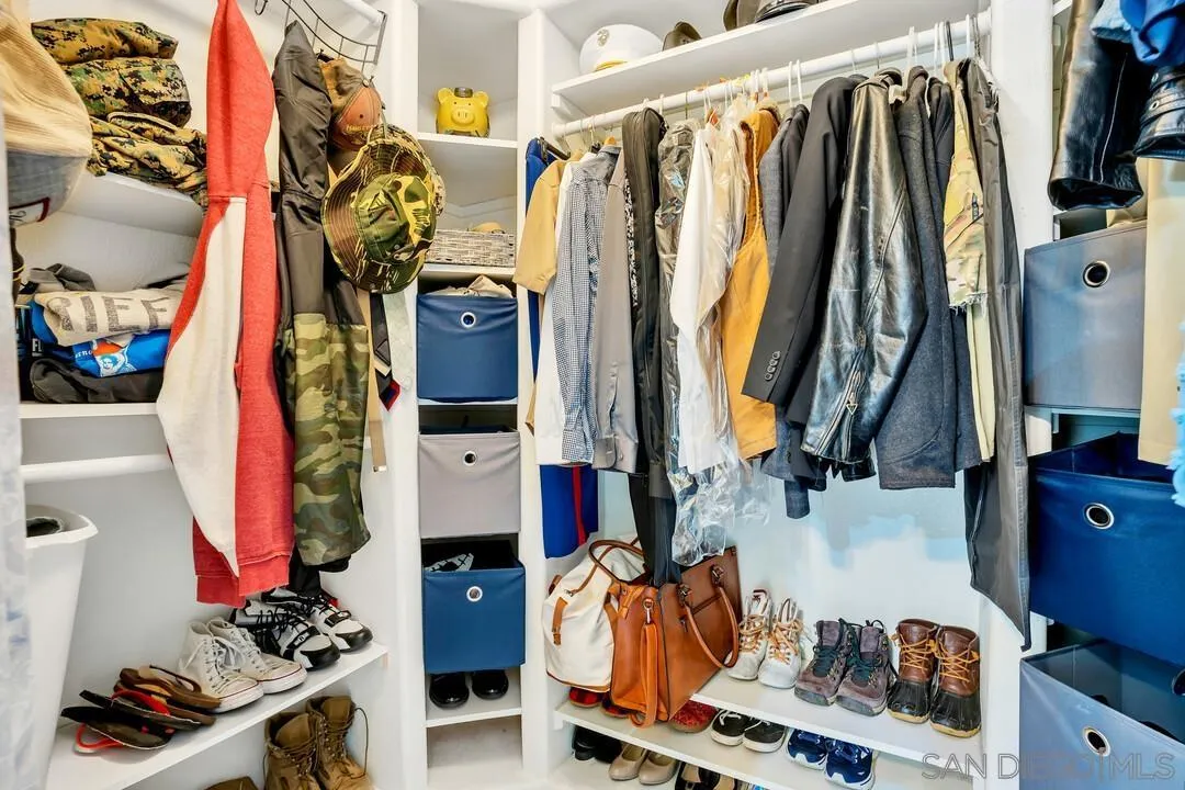 1635 Portola Avenue Spring Valley, CA 91977 - Photo 29 of 54 a view of walk in closet with clothes and shoes