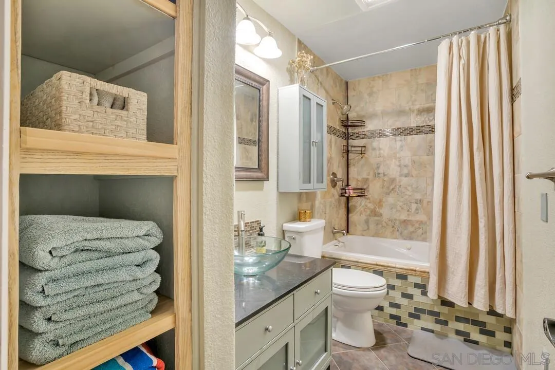 1635 Portola Avenue Spring Valley, CA 91977 - Photo 35 of 54 a bathroom with a sink a toilet and shower