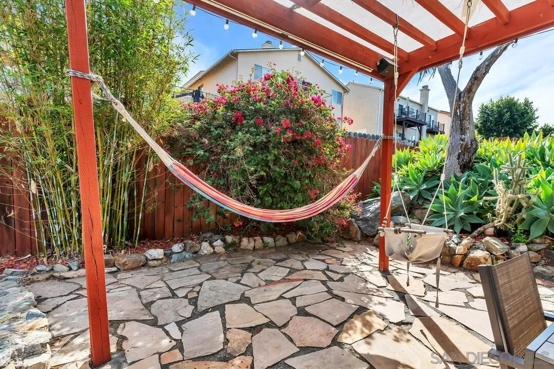 1635 Portola Avenue Spring Valley, CA 91977 - Photo 39 of 54 a view of a chair and table in the backyard