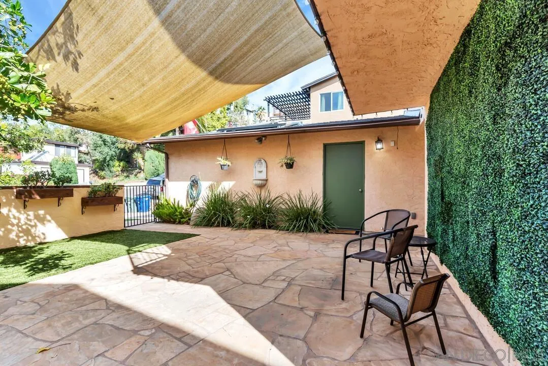 1635 Portola Avenue Spring Valley, CA 91977 - Photo 4 of 54 a view of backyard with a patio and plants