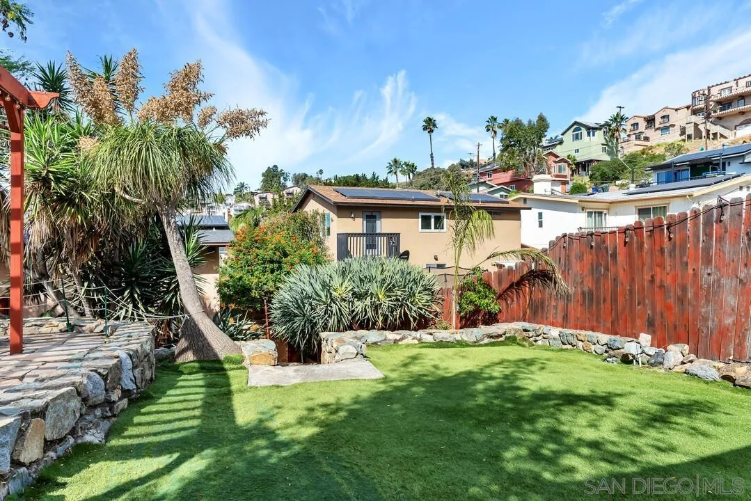 1635 Portola Avenue Spring Valley, CA 91977 - Photo 42 of 54 a view of a backyard with plants and a patio