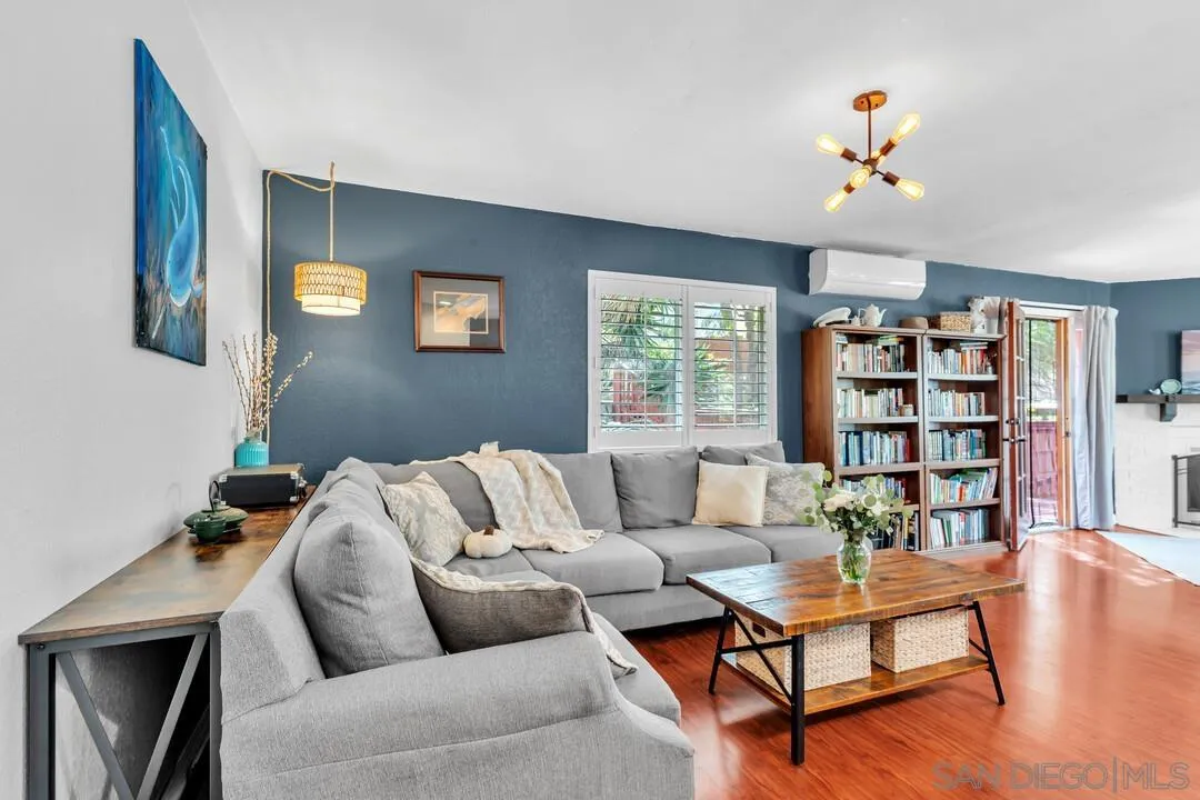 1635 Portola Avenue Spring Valley, CA 91977 - Photo 5 of 54 a living room with furniture and a book shelf