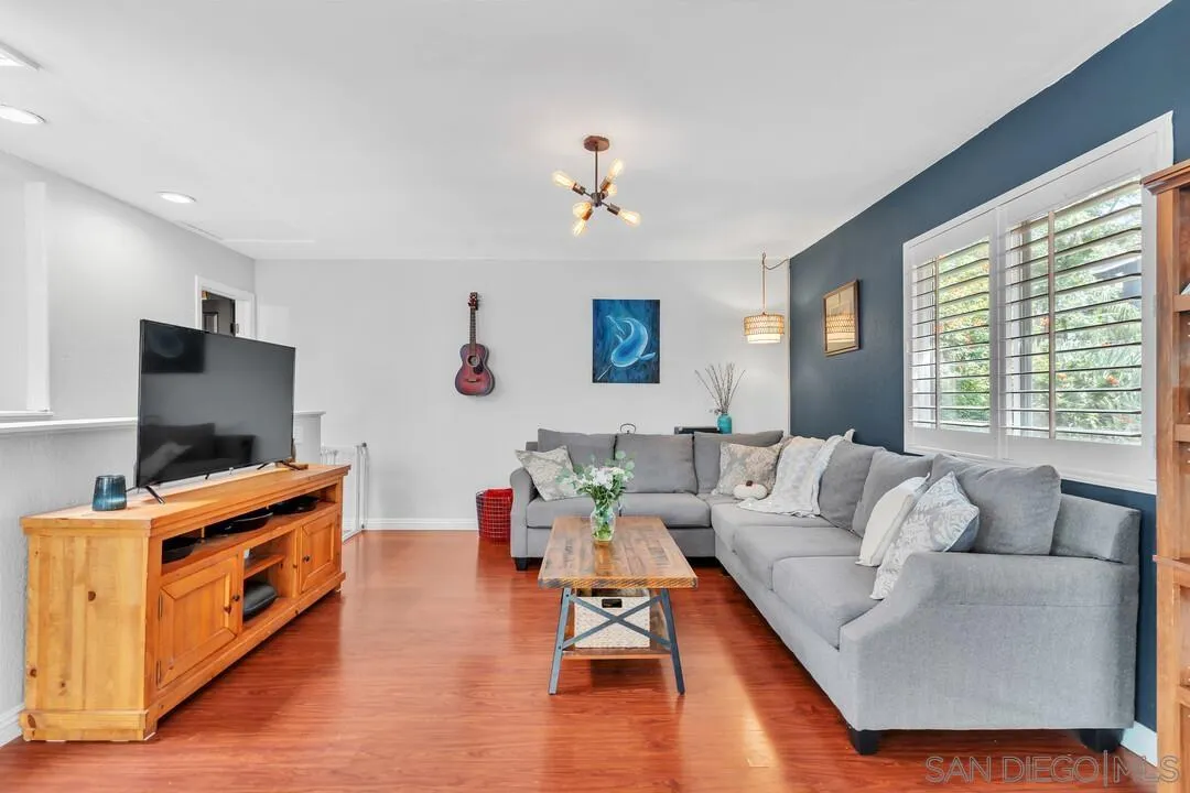 1635 Portola Avenue Spring Valley, CA 91977 - Photo 7 of 54 a living room with furniture and a flat screen tv