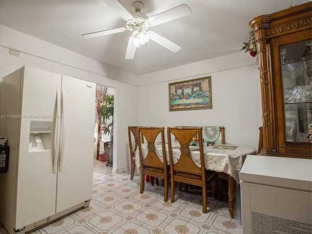 a view of kitchen with furniture stove and refrigerator