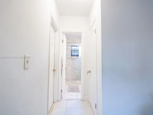 a view of a bathroom from a hallway