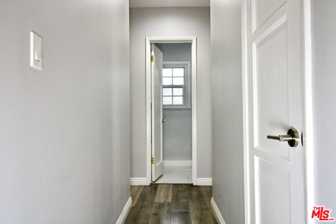 8421 Darby Avenue Northridge, CA 91325 - Photo 15 of 38 a view of a hallway with wooden floor and closet