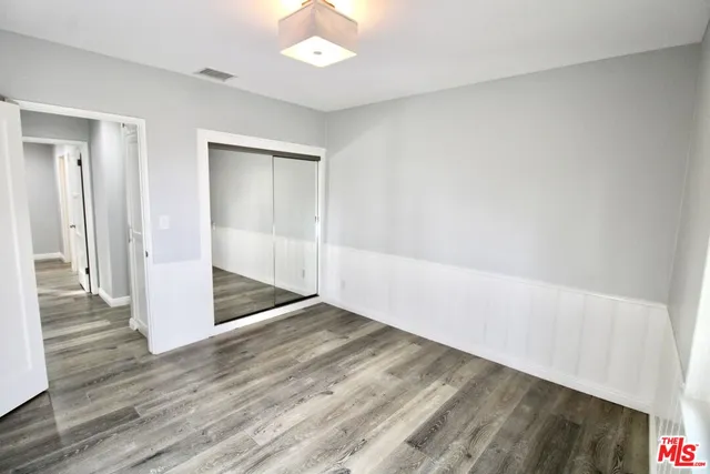 an empty room with wooden floor