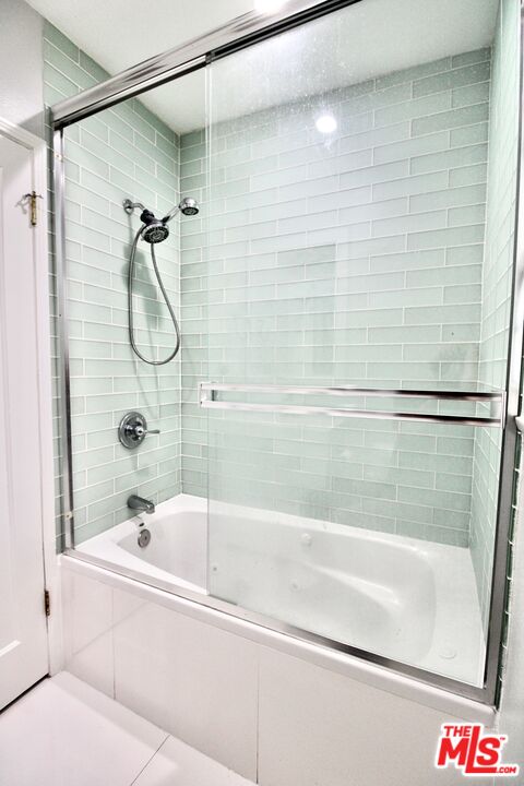 8421 Darby Avenue Northridge, CA 91325 - Photo 19 of 38 a bathroom with a bathtub and a shower
