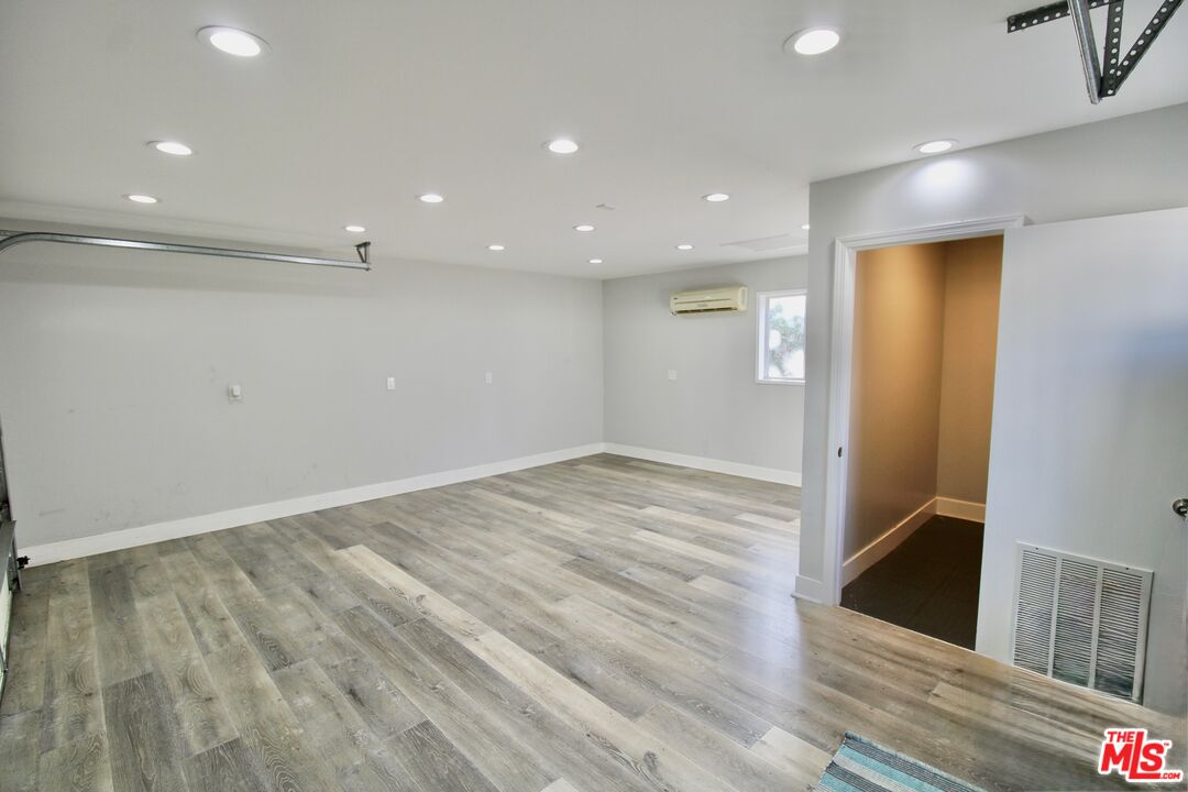 8421 Darby Avenue Northridge, CA 91325 - Photo 28 of 38 an empty room with wooden floor and entrance
