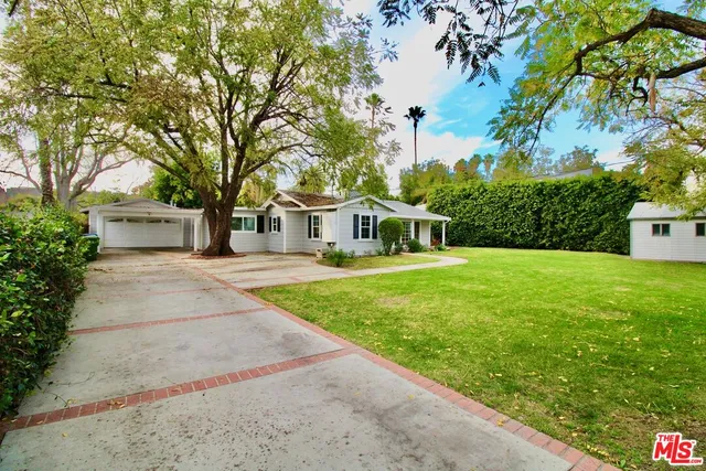 a house with garden in front of it