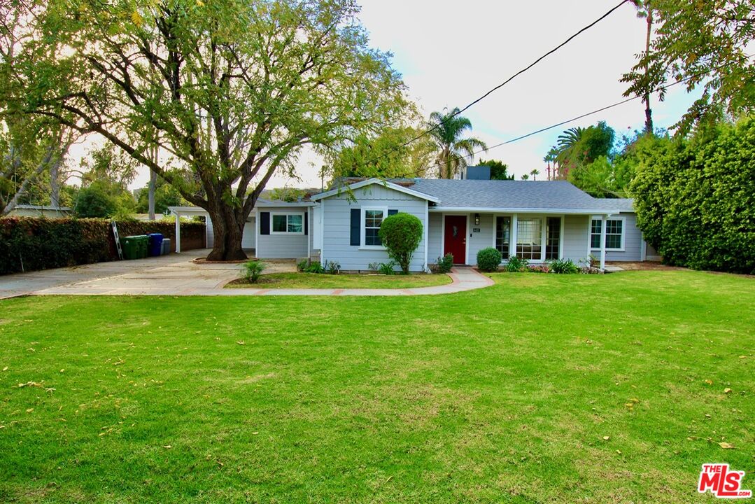 8421 Darby Avenue Northridge, CA 91325 - Photo 34 of 38 a front view of house with yard and green space